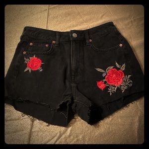 Black jean shorts with embroidered roses